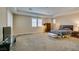 Expansive main bedroom boasts plush carpet, tray ceiling and abundant natural light from plantation shutters at 9731 Addie Meadow Ct, Las Vegas, NV 89149