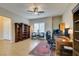 Bright office space with neutral walls, plantation shutters, a ceiling fan, and custom built-in shelving at 9731 Addie Meadow Ct, Las Vegas, NV 89149