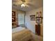 Well-lit bedroom with a quaint bed, decorative pillows, and charming wall art at 976 Dancing Vines Ave, Las Vegas, NV 89183