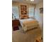 Inviting bedroom featuring a cozy bed, soft lighting, and a view of the window at 976 Dancing Vines Ave, Las Vegas, NV 89183