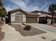 Charming single-story home with a well-maintained desert-style front yard and a two-car garage at 976 Dancing Vines Ave, Las Vegas, NV 89183