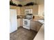 Functional kitchen with white appliances, ample cabinet space, and tile flooring at 976 Dancing Vines Ave, Las Vegas, NV 89183