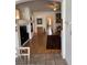 Open floor plan showing the fireplace, living room, hardwood floors and connection to other rooms at 976 Dancing Vines Ave, Las Vegas, NV 89183