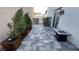 Beautifully landscaped backyard patio with planters, pavers, and an inviting outdoor space for enjoying warm evenings at 1027 Brilliant Meadow Ave, North Las Vegas, NV 89086