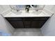 Bathroom featuring double sinks with a solid surface countertop at 1027 Brilliant Meadow Ave, North Las Vegas, NV 89086
