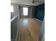 Clean bedroom featuring stylish wood flooring and neutral paint at 1027 Brilliant Meadow Ave, North Las Vegas, NV 89086