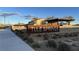 Welcoming Tule Springs community entrance with attractive landscaping, signage and community shelter, set against a scenic backdrop at 1027 Brilliant Meadow Ave, North Las Vegas, NV 89086