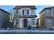 Charming two-story home with a tile roof, complemented by desert landscaping and a welcoming front entrance at 1027 Brilliant Meadow Ave, North Las Vegas, NV 89086