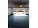 Clean, spacious garage with sealed floor, offering ample parking and storage space with a view of the neighborhood at 1027 Brilliant Meadow Ave, North Las Vegas, NV 89086