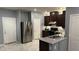 Modern kitchen with stainless steel appliances and sleek granite countertops at 1027 Brilliant Meadow Ave, North Las Vegas, NV 89086