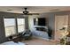 Cozy living room with a modern ceiling fan and natural light at 1027 Brilliant Meadow Ave, North Las Vegas, NV 89086