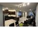 Open-concept living space featuring a well-equipped kitchen and comfortable seating at 1027 Brilliant Meadow Ave, North Las Vegas, NV 89086