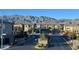Gated community street view with mountain views in the background at 1027 Brilliant Meadow Ave, North Las Vegas, NV 89086