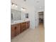 Primary bath boasts double sinks, large mirror, and direct access to the walk-in closet at 10376 Sadie Blake Ave, Las Vegas, NV 89166