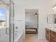 Bathroom featuring a glass enclosed shower and soaker tub at 10376 Sadie Blake Ave, Las Vegas, NV 89166