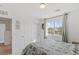 Bright bedroom with a view of the neighborhood and a walk-in closet at 10376 Sadie Blake Ave, Las Vegas, NV 89166