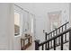 Charming entryway with natural light, stylish mirror, console table and sleek staircase at 10376 Sadie Blake Ave, Las Vegas, NV 89166