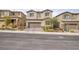 Inviting two-story home with desert landscaping, paved driveway, and two car garage at 10376 Sadie Blake Ave, Las Vegas, NV 89166