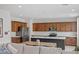 Modern kitchen featuring stainless steel appliances, a kitchen island, and ample cabinet space at 10376 Sadie Blake Ave, Las Vegas, NV 89166