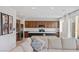 Modern kitchen featuring stainless steel appliances, a kitchen island, and ample cabinet space at 10376 Sadie Blake Ave, Las Vegas, NV 89166