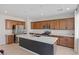 Modern kitchen featuring stainless steel appliances and a large island with a dark gray finish at 10376 Sadie Blake Ave, Las Vegas, NV 89166