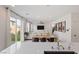 Bright living space with open floor plan and sliding door access to outdoor area at 10376 Sadie Blake Ave, Las Vegas, NV 89166