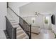 Bright staircase leading to the living room area with fresh white walls and sleek, modern finishes at 10376 Sadie Blake Ave, Las Vegas, NV 89166