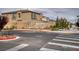 Cantaro neighborhood entrance featuring new homes, a stone sign, and well-maintained landscaping at 10376 Sadie Blake Ave, Las Vegas, NV 89166