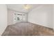 Spacious bedroom with vaulted ceilings, a ceiling fan, and a bay window offering natural light at 10505 Linden Wood Ct, Las Vegas, NV 89134