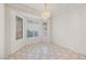 Dining area with bright lighting and geometric tiled floors at 10505 Linden Wood Ct, Las Vegas, NV 89134