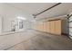 Spacious garage with ample storage cabinets and a water heater at 10505 Linden Wood Ct, Las Vegas, NV 89134