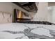 Close-up of the kitchen showcasing a white countertop with gray marbling and stainless steel appliances at 10505 Linden Wood Ct, Las Vegas, NV 89134