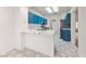 Charming kitchen features stone countertops and blue cabinetry at 10505 Linden Wood Ct, Las Vegas, NV 89134