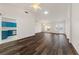 Bright living room features wood-look flooring, ceiling fan, and natural light at 10505 Linden Wood Ct, Las Vegas, NV 89134
