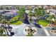 Aerial view of the gated community entrance with lush landscaping and mature trees at 11072 Pentland Downs St, Las Vegas, NV 89141