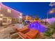 Spacious backyard features a custom pool with waterfall, mature landscaping, and outdoor living spaces at 11072 Pentland Downs St, Las Vegas, NV 89141