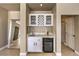 Stylish bar area with a marble countertop, wine storage, and modern finishes at 11072 Pentland Downs St, Las Vegas, NV 89141