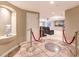 Finished basement entrance with tiled floors leading to a home theater setup at 11072 Pentland Downs St, Las Vegas, NV 89141