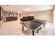 Spacious basement featuring a home theater, ping pong table, and bar area for entertaining at 11072 Pentland Downs St, Las Vegas, NV 89141