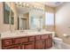 Bright bathroom with double vanity, modern lighting, and separate shower at 11072 Pentland Downs St, Las Vegas, NV 89141
