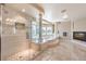 Bright bathroom with a luxurious shower, soaking tub, and modern fixtures, creating a spa-like experience at 11072 Pentland Downs St, Las Vegas, NV 89141