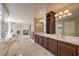 Spacious bathroom featuring a double vanity, fireplace and separate tub and shower at 11072 Pentland Downs St, Las Vegas, NV 89141