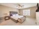 Comfortable bedroom featuring a ceiling fan, shutters and a bench seat at 11072 Pentland Downs St, Las Vegas, NV 89141