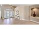 Welcoming foyer with tile flooring, decorative mirror, and a view of the front door at 11072 Pentland Downs St, Las Vegas, NV 89141