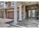 Grand front entrance with stone accents, stately columns, and a covered porch at 11072 Pentland Downs St, Las Vegas, NV 89141