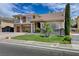 Elegant two-story home with well-manicured lawn and a three-car garage at 11072 Pentland Downs St, Las Vegas, NV 89141