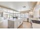 Modern and bright kitchen featuring a large island, stainless steel appliances, and ample cabinet space at 11072 Pentland Downs St, Las Vegas, NV 89141