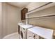 Functional laundry room with modern appliances, a sink, and upper cabinets at 11072 Pentland Downs St, Las Vegas, NV 89141