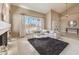Cozy living room with vaulted ceiling, large windows, and stylish decor at 11072 Pentland Downs St, Las Vegas, NV 89141