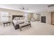 Bright main bedroom featuring a king bed, soft carpet, and a serene atmosphere at 11072 Pentland Downs St, Las Vegas, NV 89141